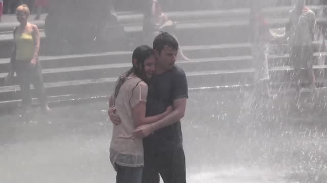 News video: Katie Holmes Gets Soaked in a T-Shirt While Playing in a Fountain